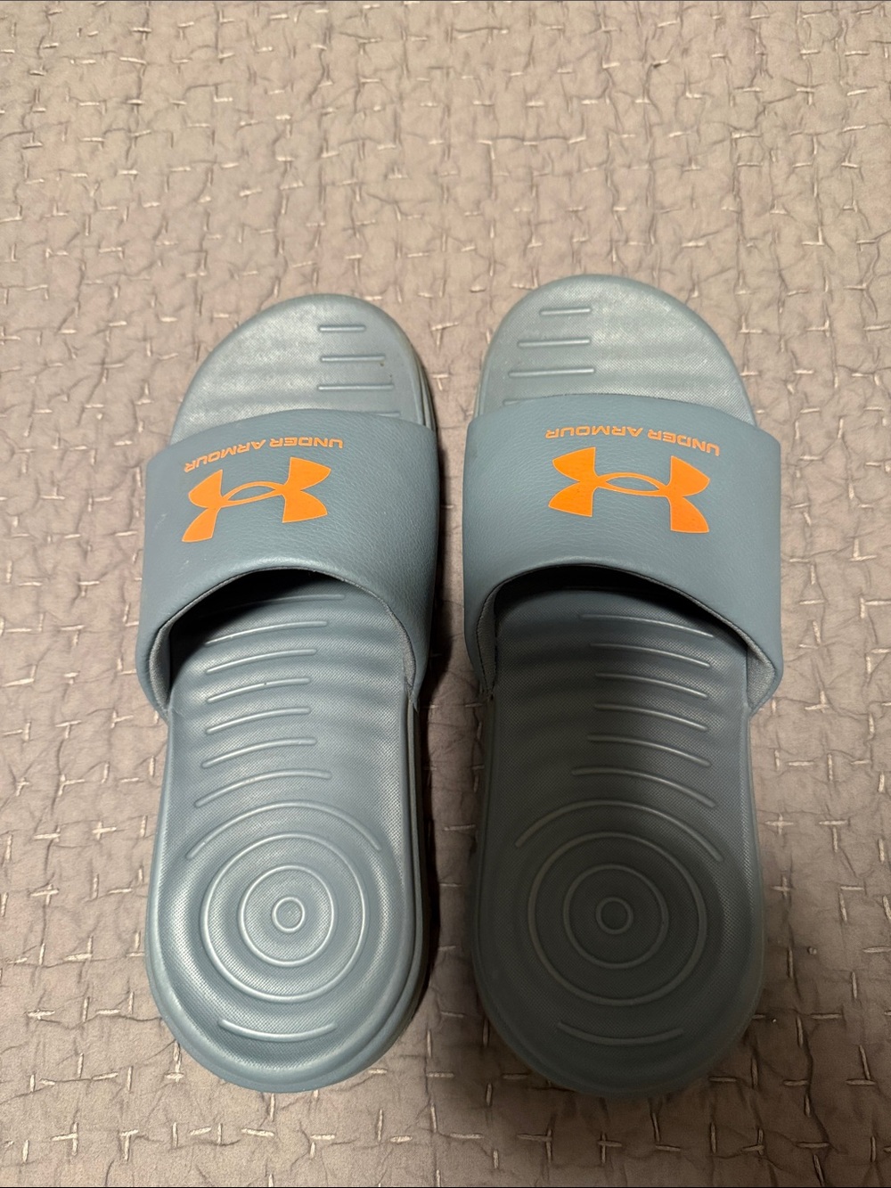 Under Armour Kids Slide Sandals in Light Gray with Orange Logo